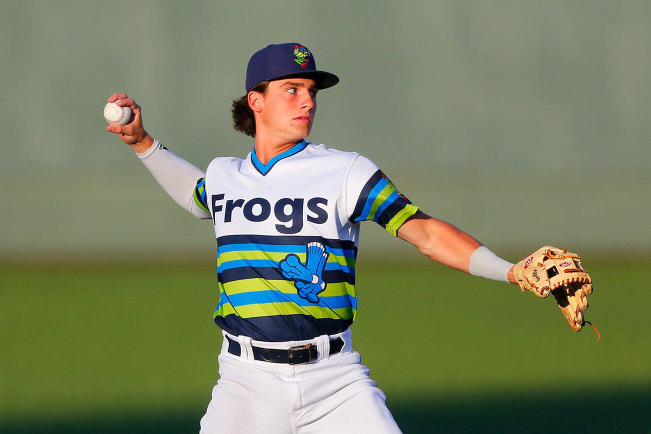 AquaSox shortstop Cole Young, one of Seattle’s top prospects, warms up between innings during a game against Hillsboro on Thursday, August 17, 2023, at Funko Field in Everett, Washington. (Ryan Berry / The Herald)