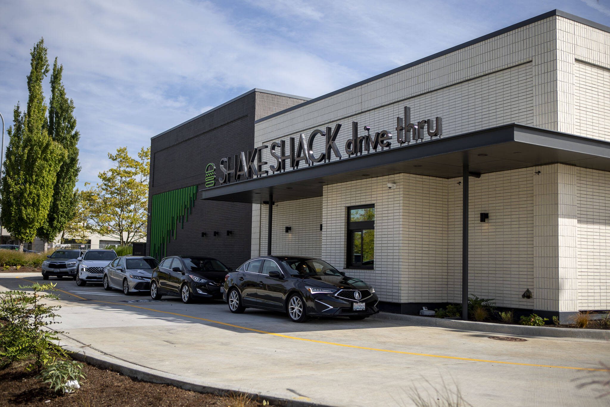 Lines of cars form at the newly opened Shake Shack drive-thru location in Lynnwood, Washington on Sunday, Sept. 10, 2023. (Annie Barker / The Herald)