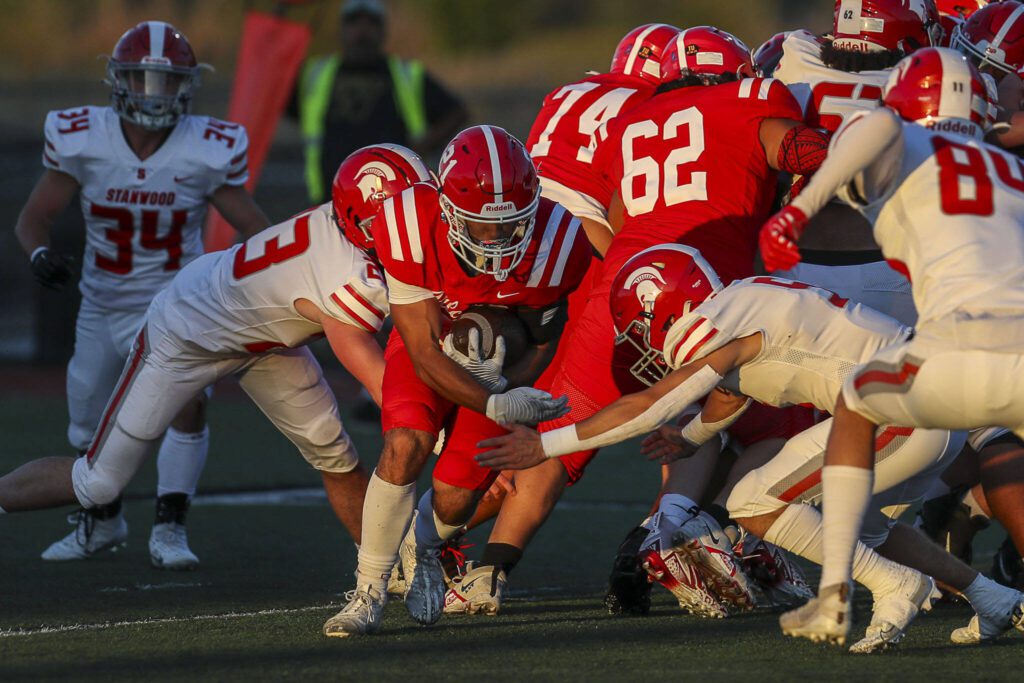 Marysville Pilchuck’s Kenai Sinaphet (21) moves with the ball during a football game between Marysville Pilchuck and Stanwood at Marysville Pilchuck High School in Marysville, Washington on Friday, Sept. 8, 2023. Marysville Pilchuck takes the win, 36-7. (Annie Barker / The Herald)
