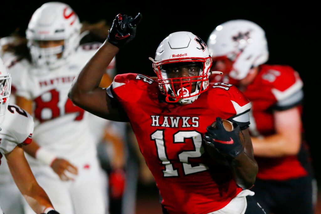 Mountlake Terrace’s Zaveon Jones weaves his way through the defense during a game against Snohomish on Friday evening at Edmonds Stadium. (Ryan Berry / The Herald)
