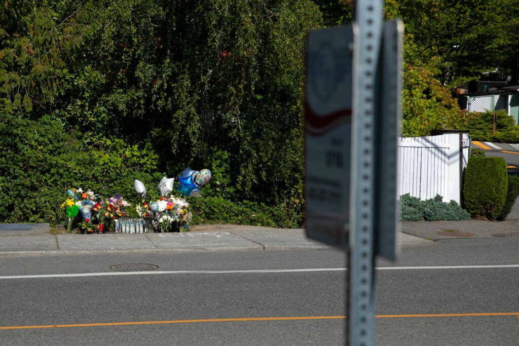 A memorial for a 15-year-old boy shot and killed last week is set up at a bus stop along Hardeson Road on Wednesday, Sept. 13, 2023, in Everett, Washington. (Ryan Berry / The Herald)
