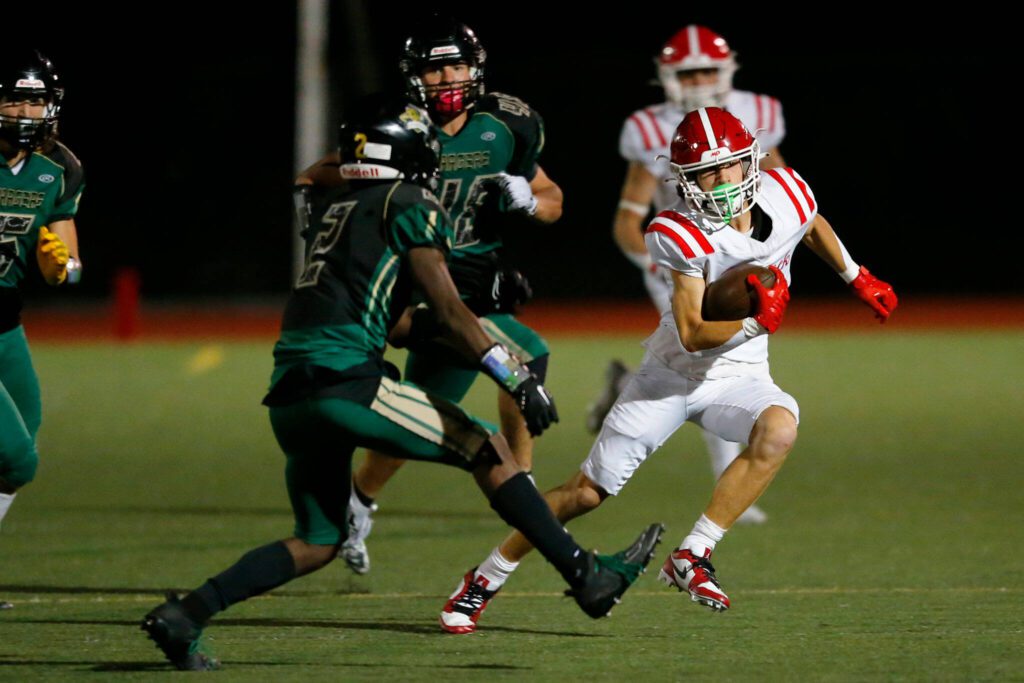 Marysville Pilchuck sophomore Marcus Gaffney takes a short pass for big yardage in the second half against Marysville Getchell during the Berry Bowl on Friday, Sept. 15, 2023, at Quil Ceda Stadium in Marysville, Washington. (Ryan Berry / The Herald)
