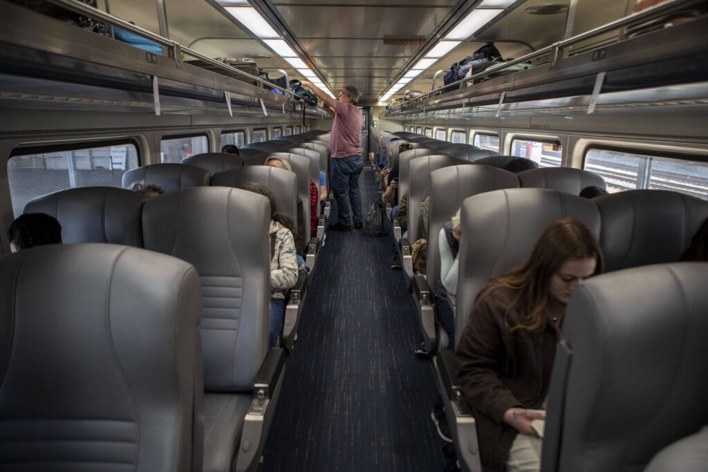 Unlike air travel, there are no assigned seats on Amtrak coach cars — and no intrusive security in the train depots. (Annie Barker / The Herald)
