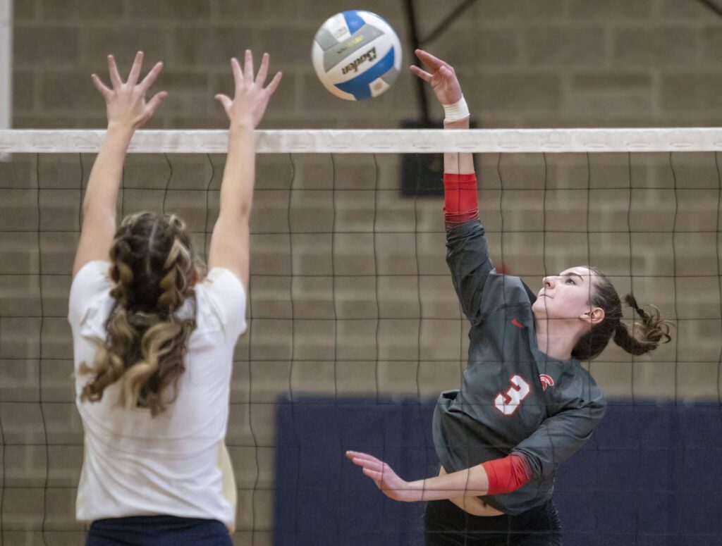 Stanwood’s Cambrielle Brown spikes the ball over the net during the game against Arlington on Tuesday, Sept. 19, 2023 in Arlington, Washington. (Olivia Vanni / The Herald)
