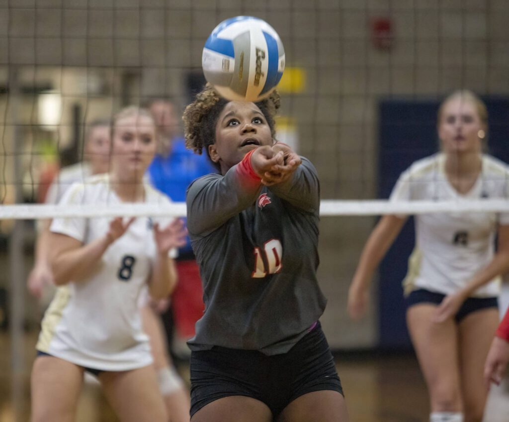Stanwood’s Ng’andu-Tsianna Mumbuluma bumps the ball during the game against Arlington on Tuesday, Sept. 19, 2023 in Arlington, Washington. (Olivia Vanni / The Herald)
