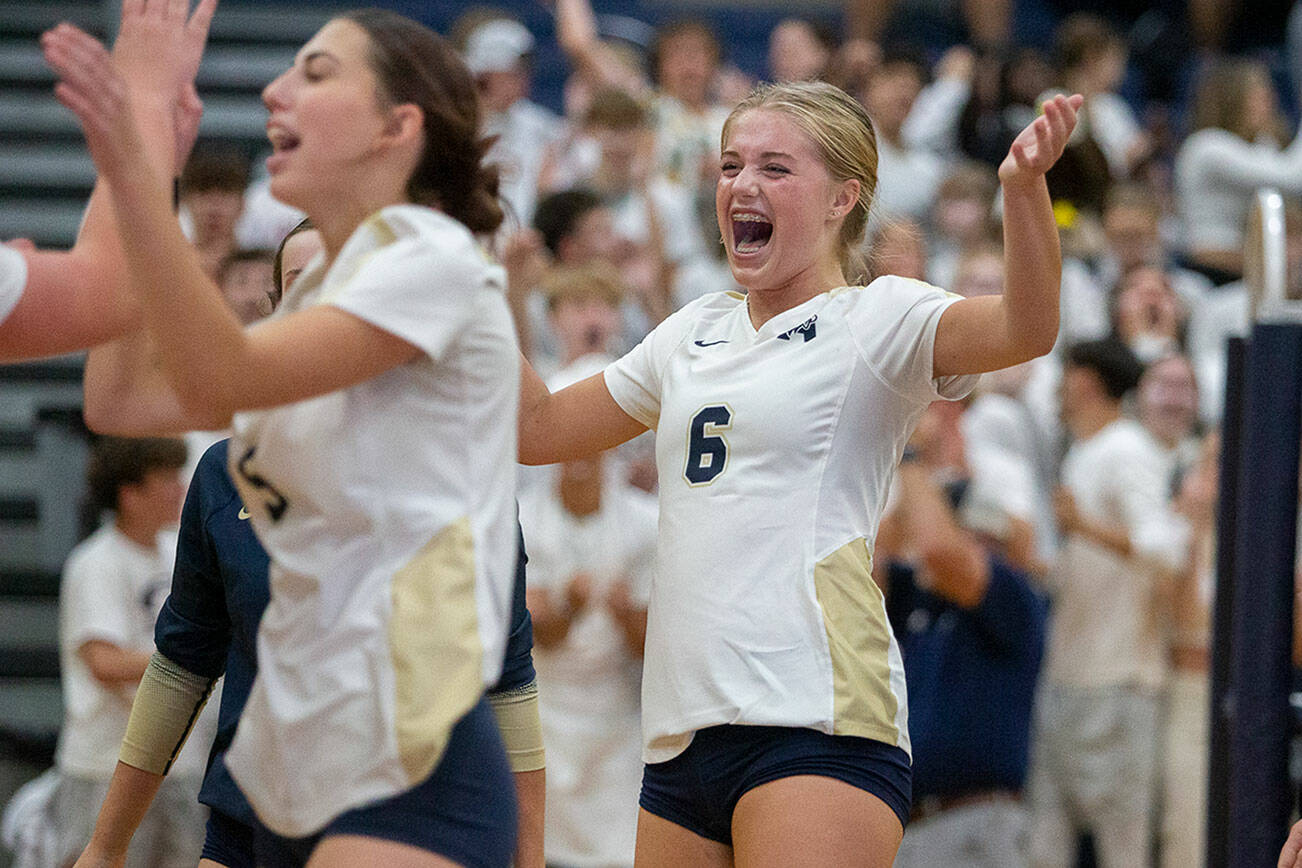 Arlington’s Emme Shaffer reacts to scoring point during the game against Stanwood on Tuesday, Sept. 19, 2023 in Arlington, Washington. (Olivia Vanni / The Herald)