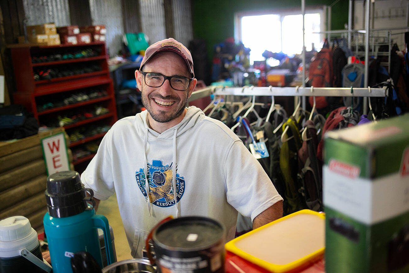 Chap Grubb, founder and CEO of second-hand outdoor gear store Rerouted, stands inside his new storefront on Thursday, Sept. 21, 2023, in Gold Bar, Washington. Rerouted began as an entirely online shop that connected buyers and sellers of used gear.  (Ryan Berry / The Herald)