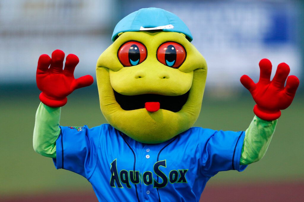 Webbly emerges from the stands during the season opener against the Eugene Emeralds on Friday, April 7, 2023, at Funko Field in Everett, Washington. (Ryan Berry / The Herald)
