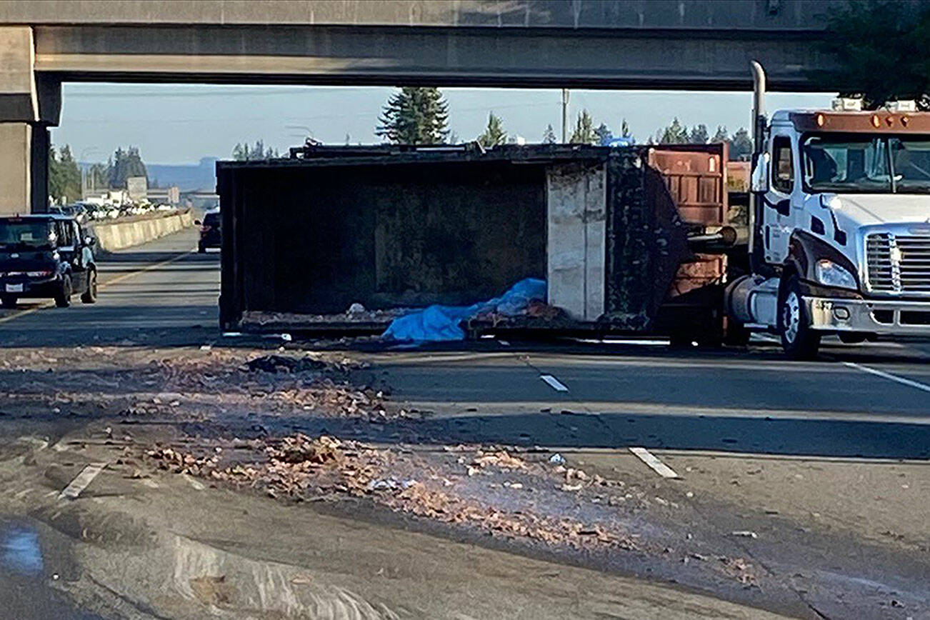 A semi-truck rolled over blocking all traffic lanes Thursday morning on I-5 north just south of Arlington on Sept. 21, 2023. (Washington State Patrol)
