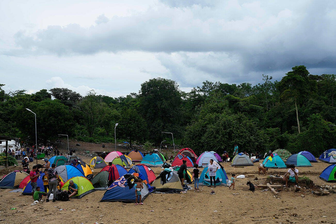 Migrants trying to reach the United States, set up a camp in Lajas Blancas, Darien province, Panama, Saturday, Sept. 23, 2023. (AP Photo/Arnulfo Franco)