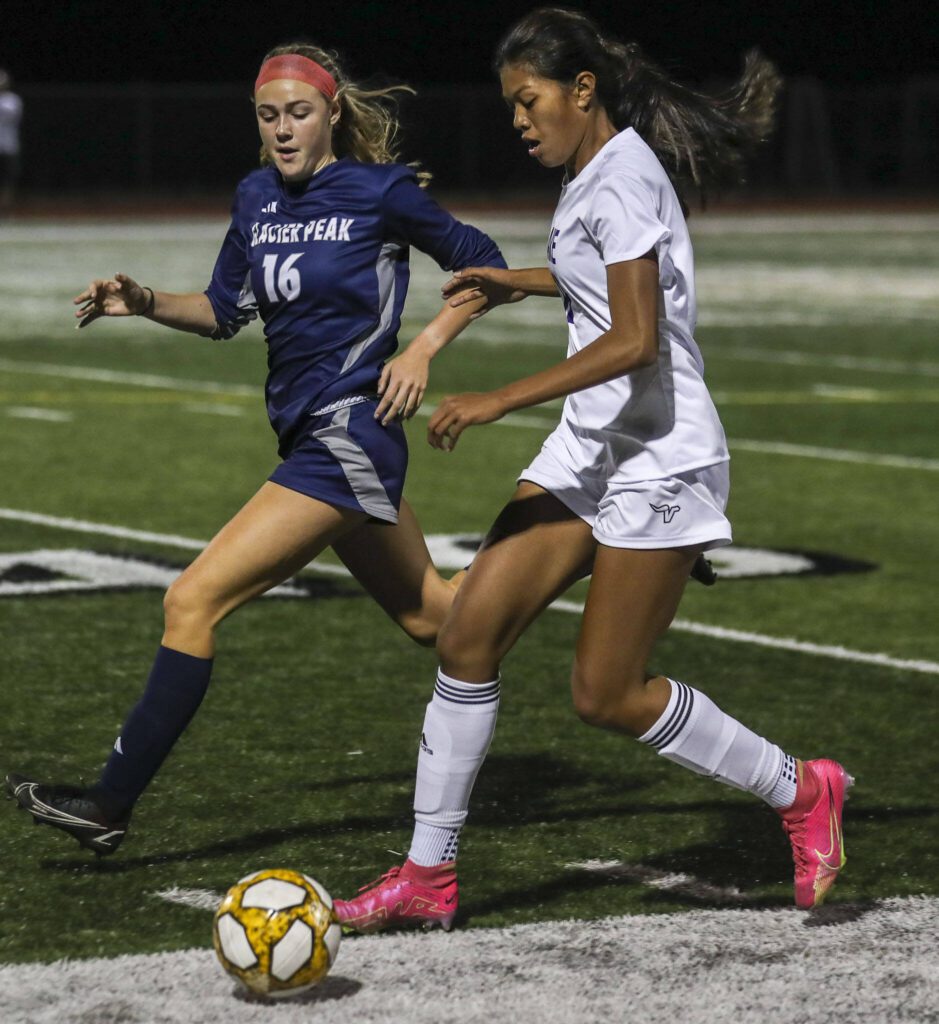 Glacier Peak’s Sarah Stein (16) and Lake Stevens’ Noelani Tupua (18) fight for the ball during a girls soccer game between Glacier Peak and Lake Stevens at Glacier Peak High School in Snohomish, Washington on Thursday, Sept. 21, 2023. Lake Stevens won, 2-1. (Annie Barker / The Herald)
