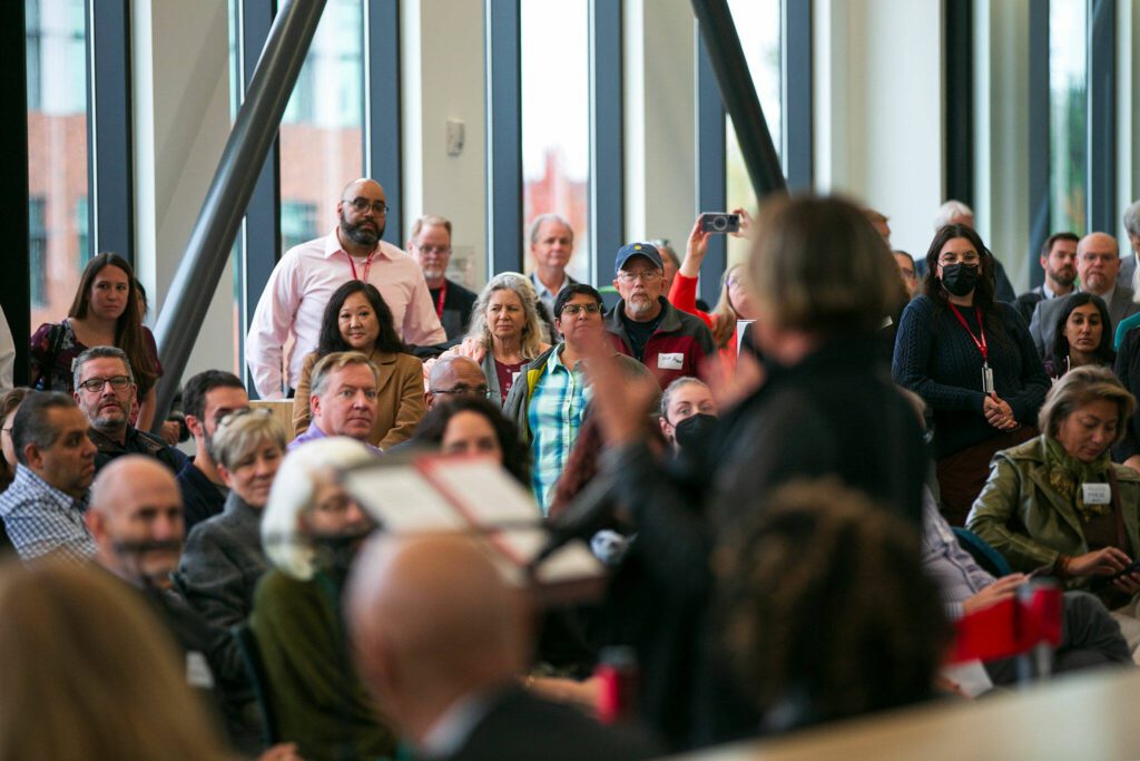 A packed room listens as Everett Mayor Cassie Franklin speaks during the ribbon cutting ceremony of the new Cascade Learning Center on Thursday, Sept. 28, 2023, at Everett Community College in Everett, Washington. (Ryan Berry / The Herald)
