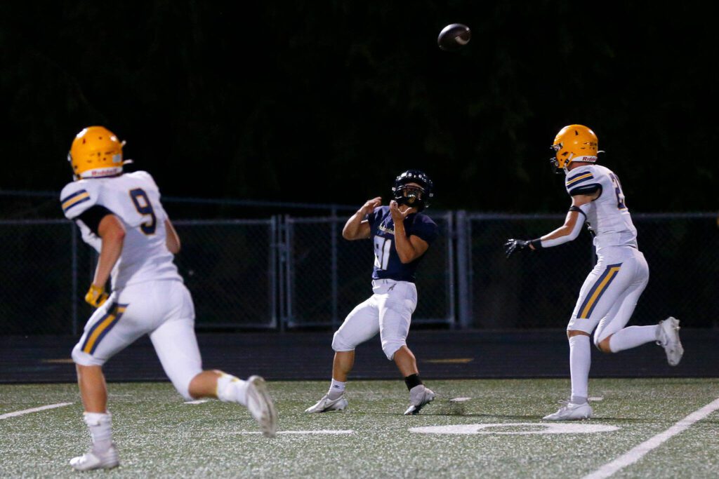 Arlington senior Stevie Balderas comes down with a catch against Ferndale on Friday, Sept. 22, 2023, at Arlington High School in Arlington, Washington. (Ryan Berry / The Herald)
