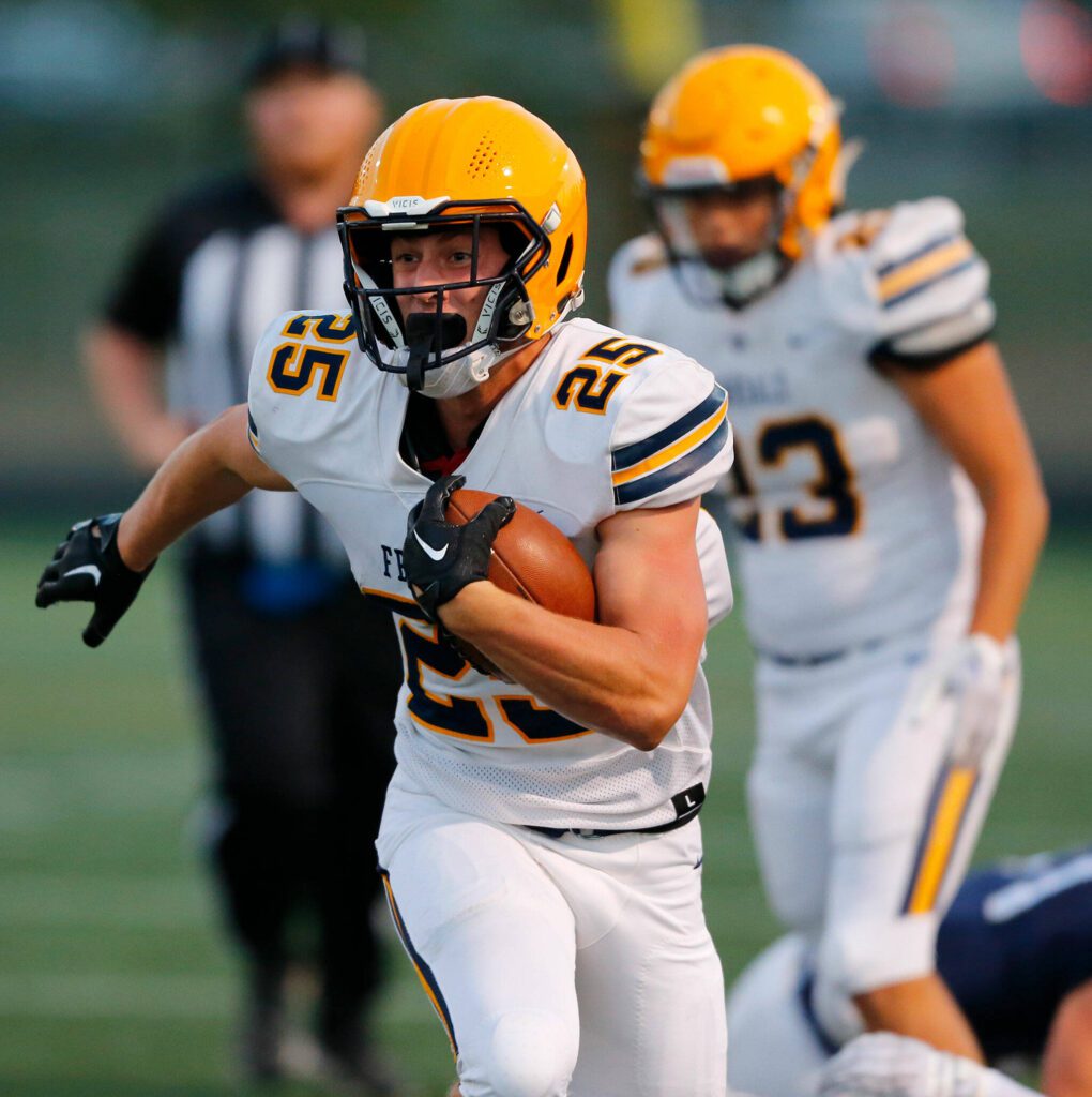 Ferndale’s Conner Walcker breaks off a big run during his team’s first possession against Arlington on Friday, Sept. 22, 2023, at Arlington High School in Arlington, Washington. (Ryan Berry / The Herald)
