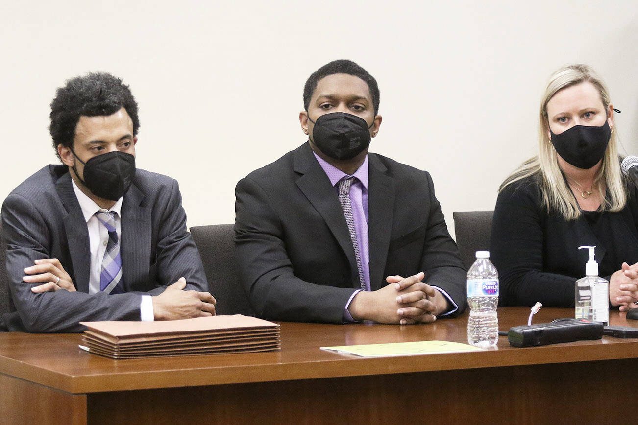 Jamel Alexander, center, listens as a Snohomish County jury records their verdict of guilty, in the murder of Shawna Brune, on Tuesday, May 18, 2021 in Everett, Washington.  Alexander was convicted in the first degree murder of Brune. (Andy Bronson / The Herald)