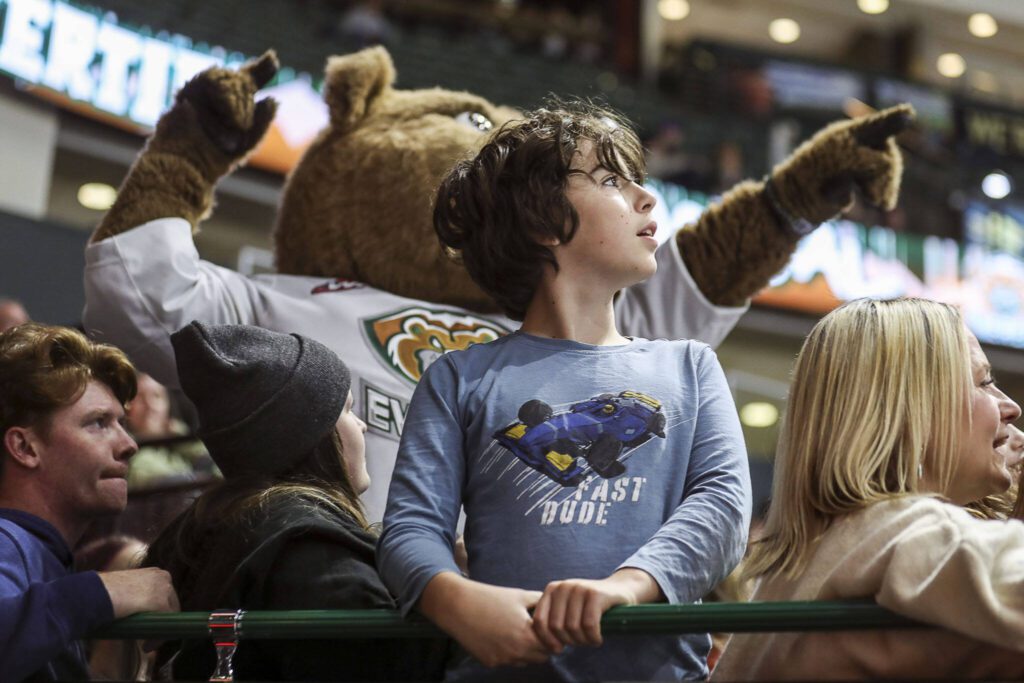 A child looks to the scoreboard during a game between the Everett Silvertips and Victoria Royals at the Angel of the Winds Arena on Saturday, Sept. 23, 2023. The Silvertips won, 5-3. (Annie Barker / The Herald)
