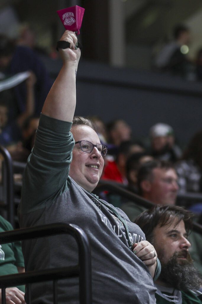 A fan rings a cowbell during a game between the Everett Silvertips and Victoria Royals at the Angel of the Winds Arena on Saturday, Sept. 23, 2023. The Silvertips won, 5-3. (Annie Barker / The Herald)
