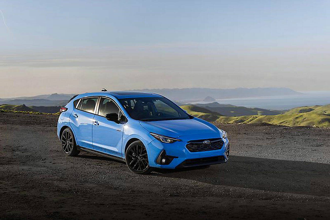 Dark gray wheels and black exterior accents provide extra visual appeal for the 2024 Subaru Impreza’s RS trim. (Subaru)