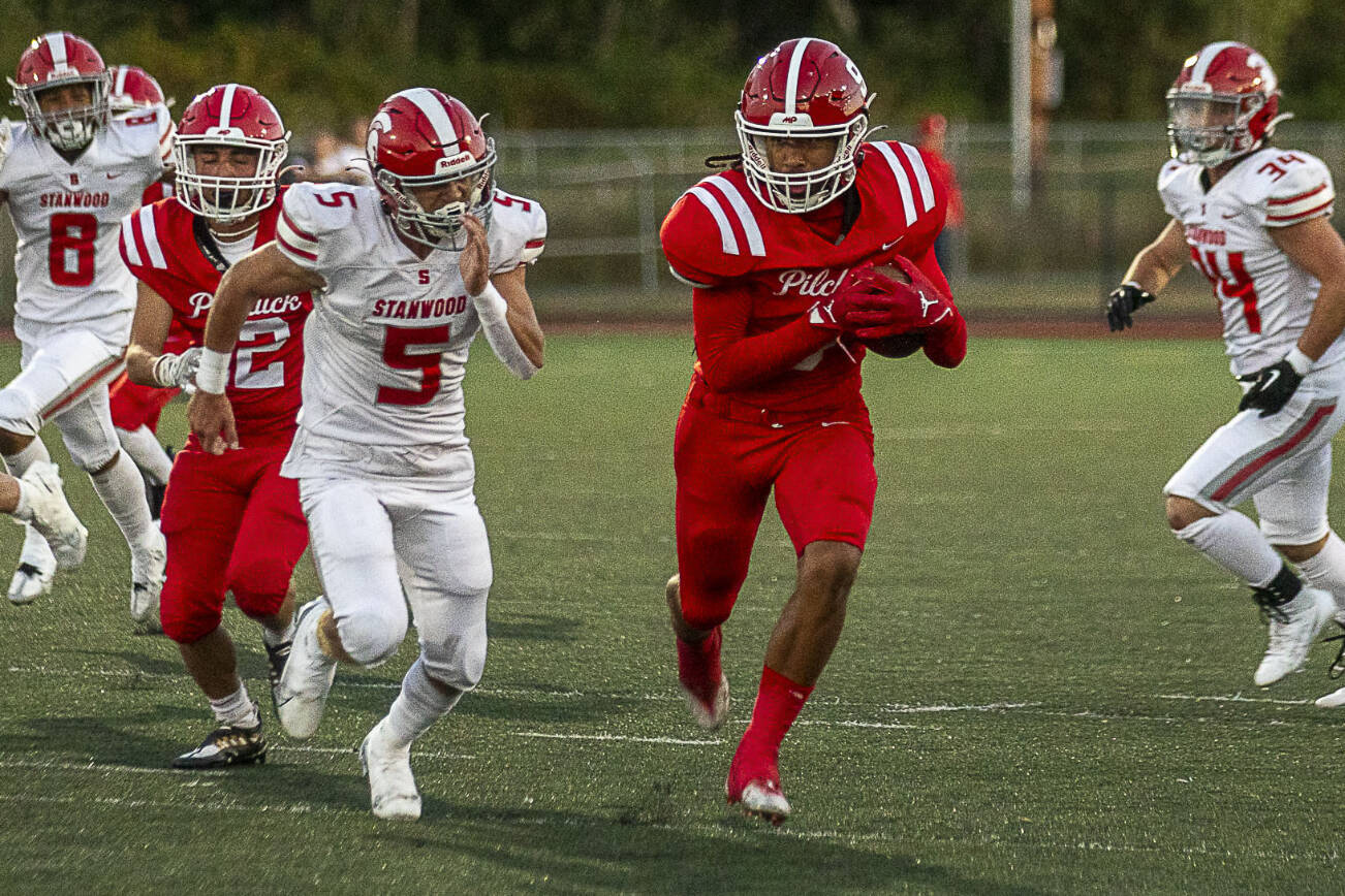 Marysville Pilchuck’s Dominik Kendrick (9) runs with the ball during a football game between Marysville Pilchuck and Stanwood at Marysville Pilchuck High School in Marysville, Washington on Friday, Sept. 8, 2023. Marysville Pilchuck takes the win, 36-7. (Annie Barker / The Herald)