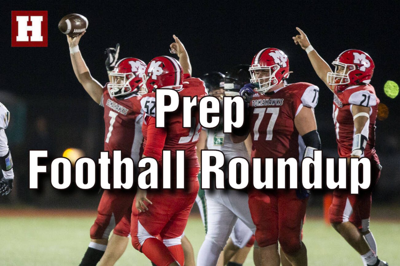 Marysville Pilchuck’s Christian Van Natta lifts the ball in the air to celebrate a turnover during the game against Marysville Getchell on Friday, Sept. 16, 2022 in Marysville, Washington. (Olivia Vanni / The Herald)