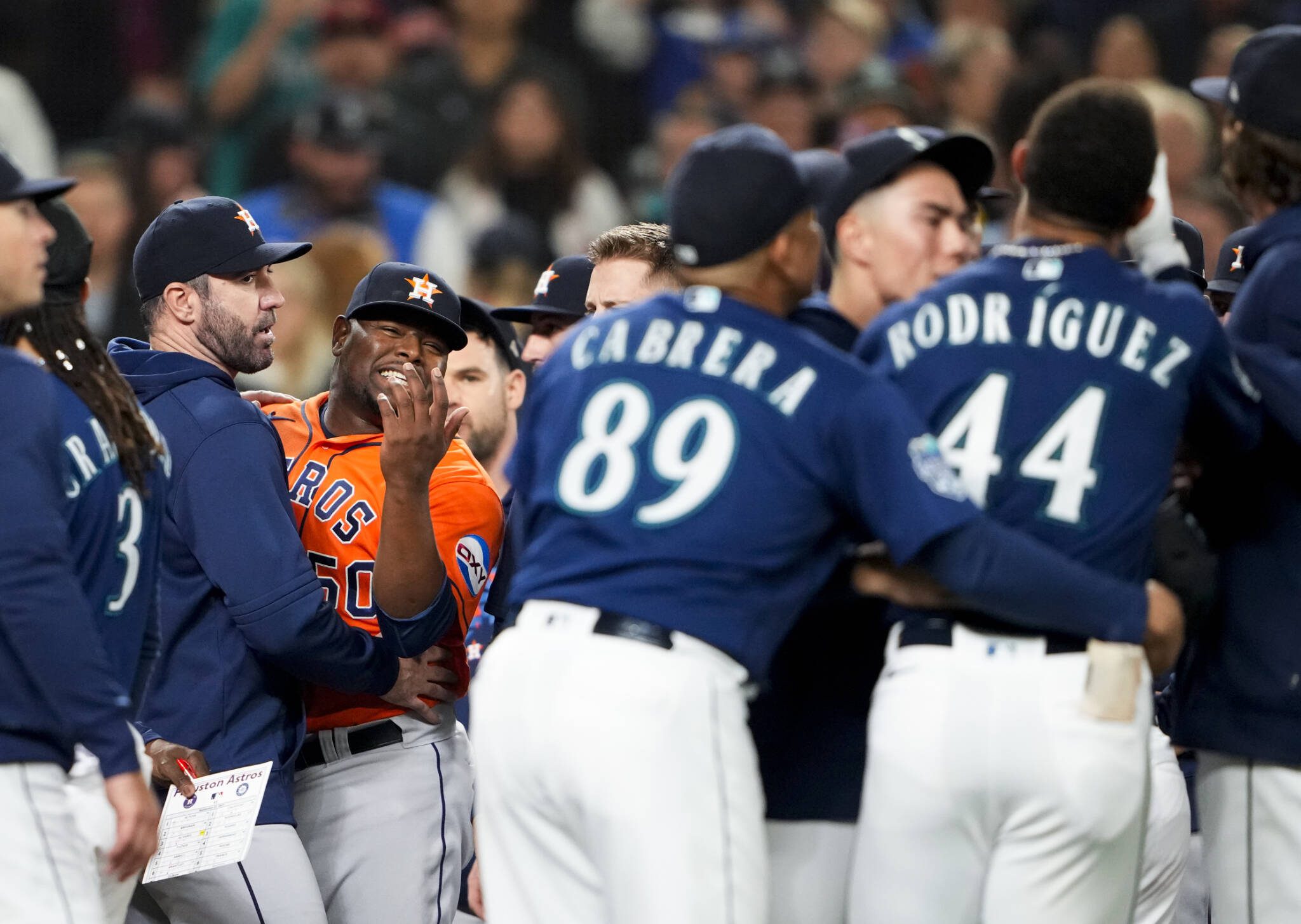 Astros relief pitcher Hector Neris (50) gestures to the Mariners’ Julio Rodríguez (44) after striking Rodríguez out to end the sixth inning of a game Wednesday in Seattle. (AP Photo/Lindsey Wasson)