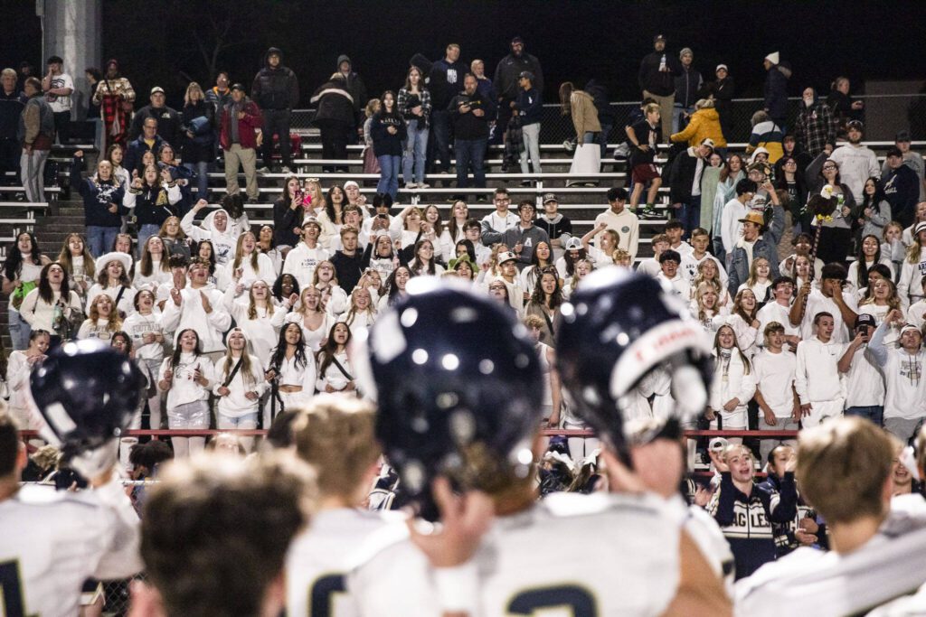 Arlington fans cheer with the team after the win against Stanwood for the Stilly Cup on Friday, Sept. 29, 2023 in Stanwood, Washington. (Olivia Vanni / The Herald)
