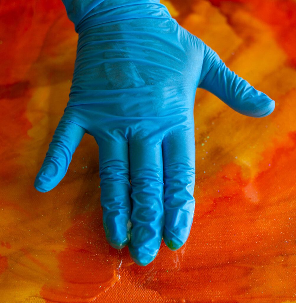 Gloves and a respirator are musts when working with epoxy resin. (Ryan Berry / The Herald)

