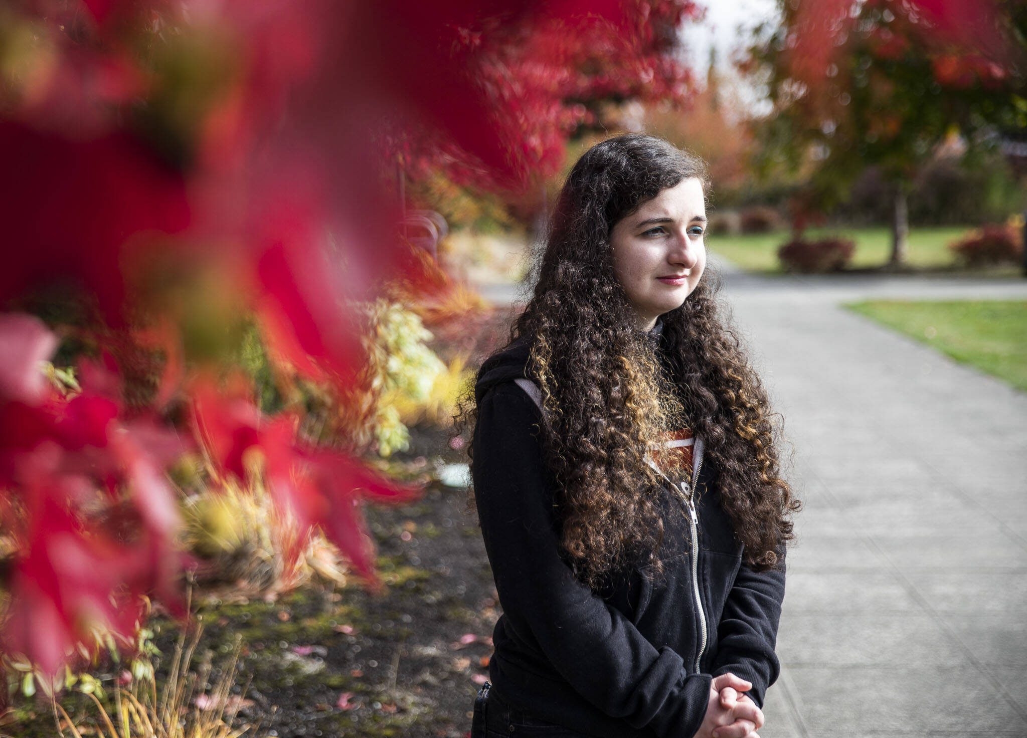 Kira Violette, a graphic designer for Everett Community College, on campus on Tuesday, Oct. 3, 2023 in Everett, Washington. Violette has $35,000 in student loan debt and will have $400 a month payments when she has to start paying them back. (Olivia Vanni / The Herald)