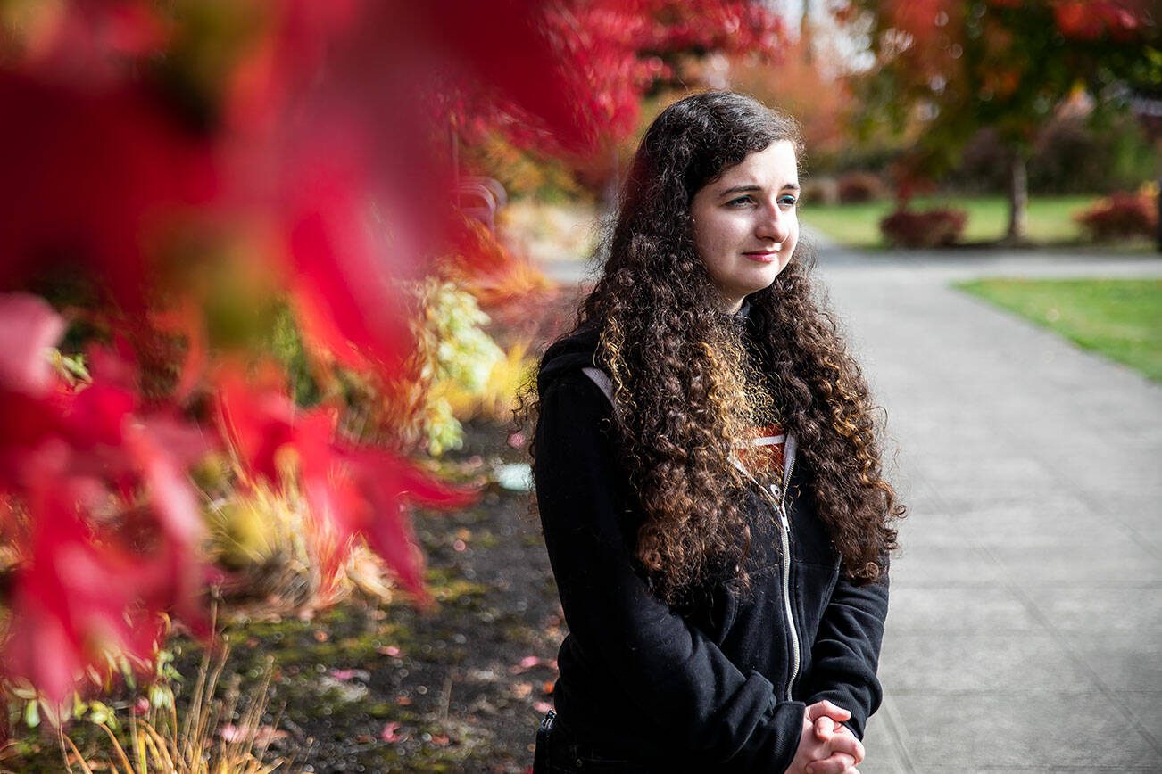 Kira Violette, a graphic designer for Everett Community College, on campus on Tuesday, Oct. 3, 2023 in Everett, Washington. Violette has $35,000 in student loan debt and will have $400 a month payments when she has to start paying them back. (Olivia Vanni / The Herald)