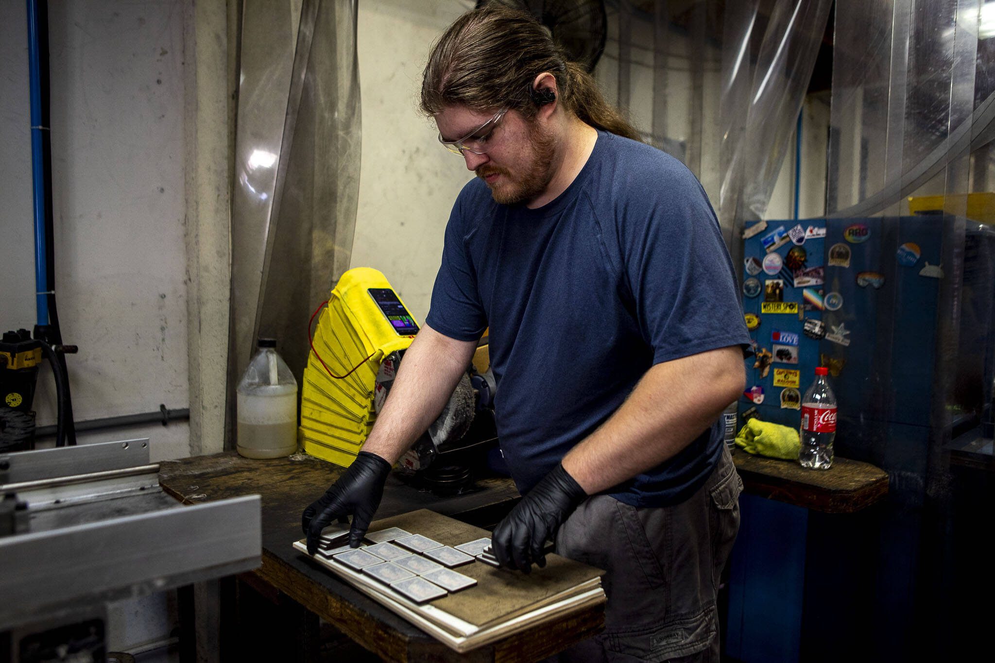 Ethan Denson stacks magnets in a box at Morris Magnets in Monroe, Washington on Wednesday, Sept. 13, 2023. (Annie Barker / The Herald)