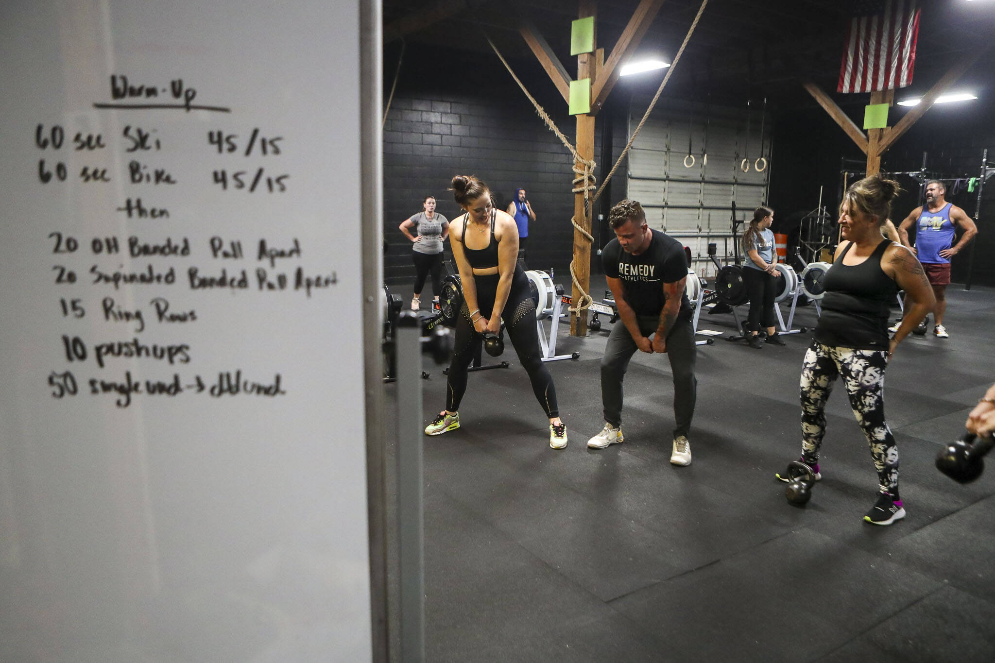 Harrison Wolff, center, instructs how to use kettle balls during a class at Remedy Athletics in Marysville, Washington on Wednesday, Oct. 11, 2023. (Annie Barker / The Herald)