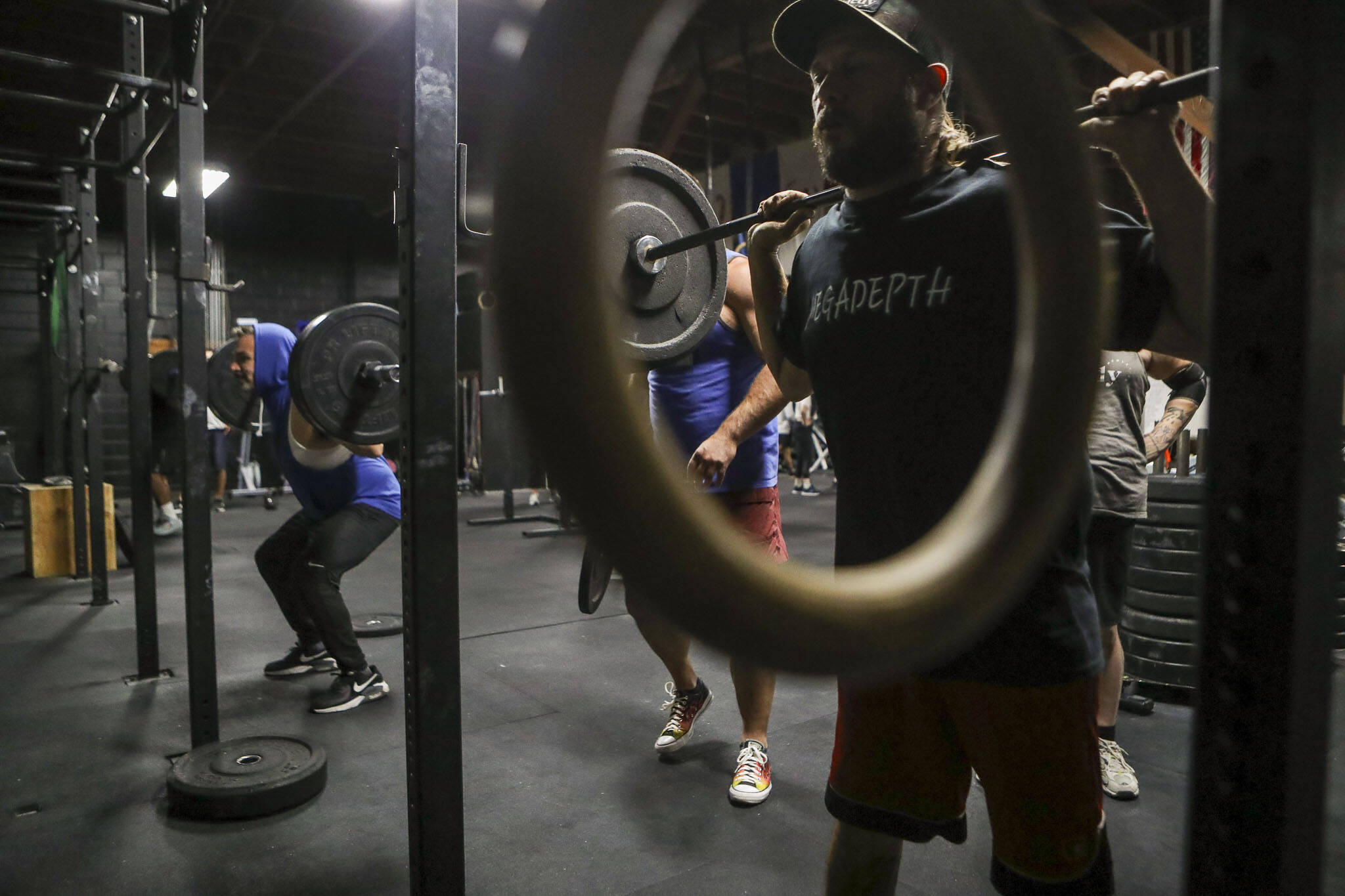 Participants complete training exercises during a class lead by Harrison Wolff at Remedy Athletics in Marysville, Washington on Wednesday, Oct. 11, 2023. (Annie Barker / The Herald)
