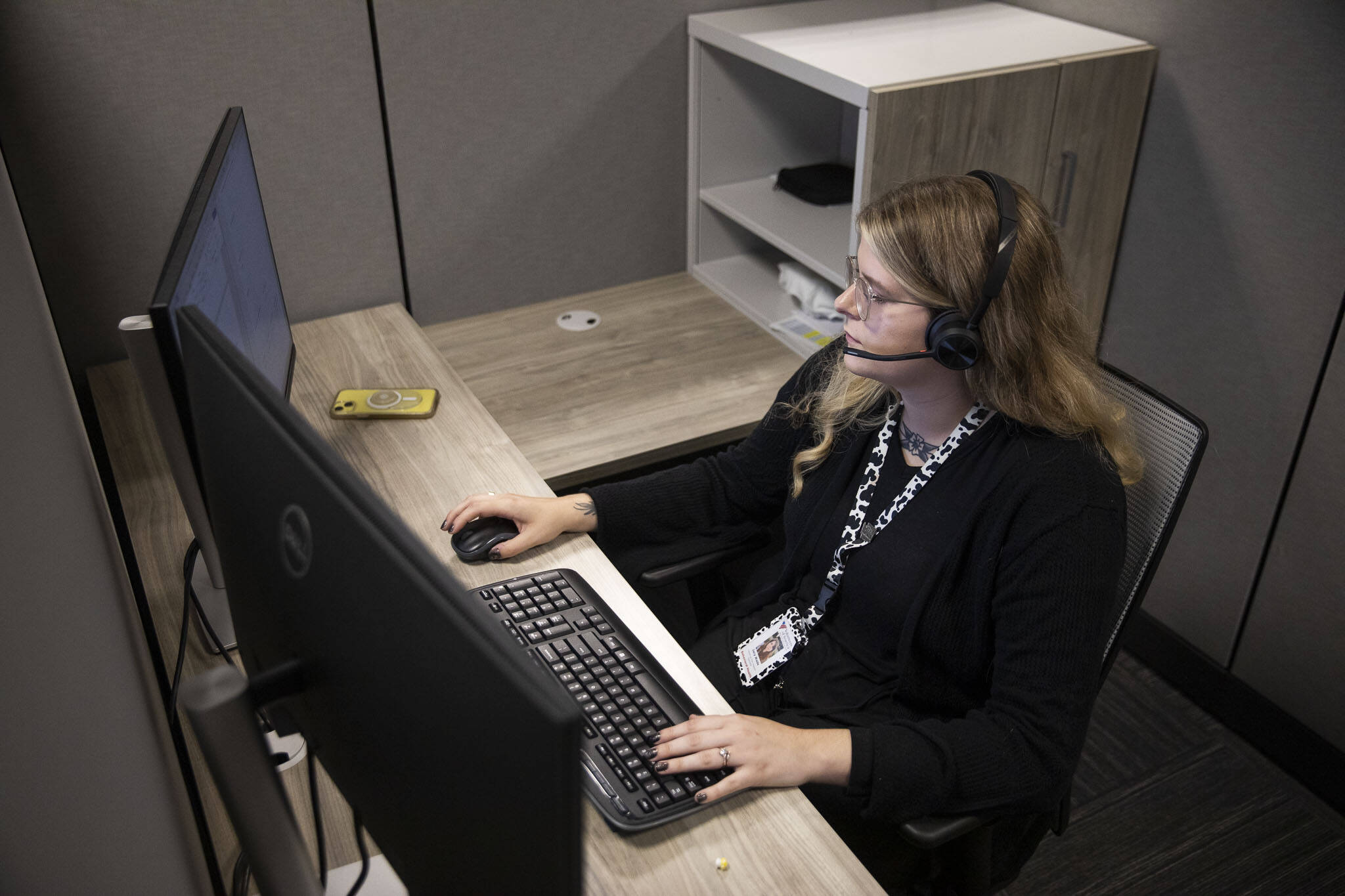 Jacy Wade, a 988 crisis counselor, talks to caller during her shift on Friday, Oct. 6, 2023 in Everett, Washington. (Olivia Vanni / The Herald)