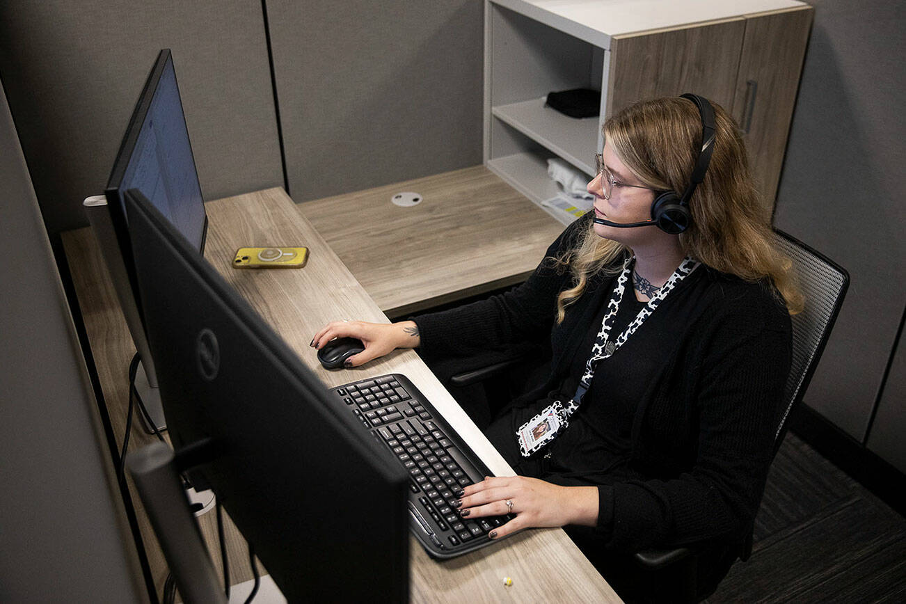 Jacy Wade, a 988 crisis counselor, talks to caller during her shift on Friday, Oct. 6, 2023 in Everett, Washington. (Olivia Vanni / The Herald)