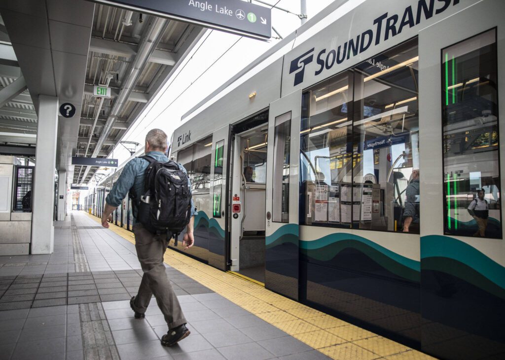 A person steps off the light rail at Northgate Station on Wednesday, Oct. 4, 2023 in Seattle, Washington. (Olivia Vanni / The Herald)
