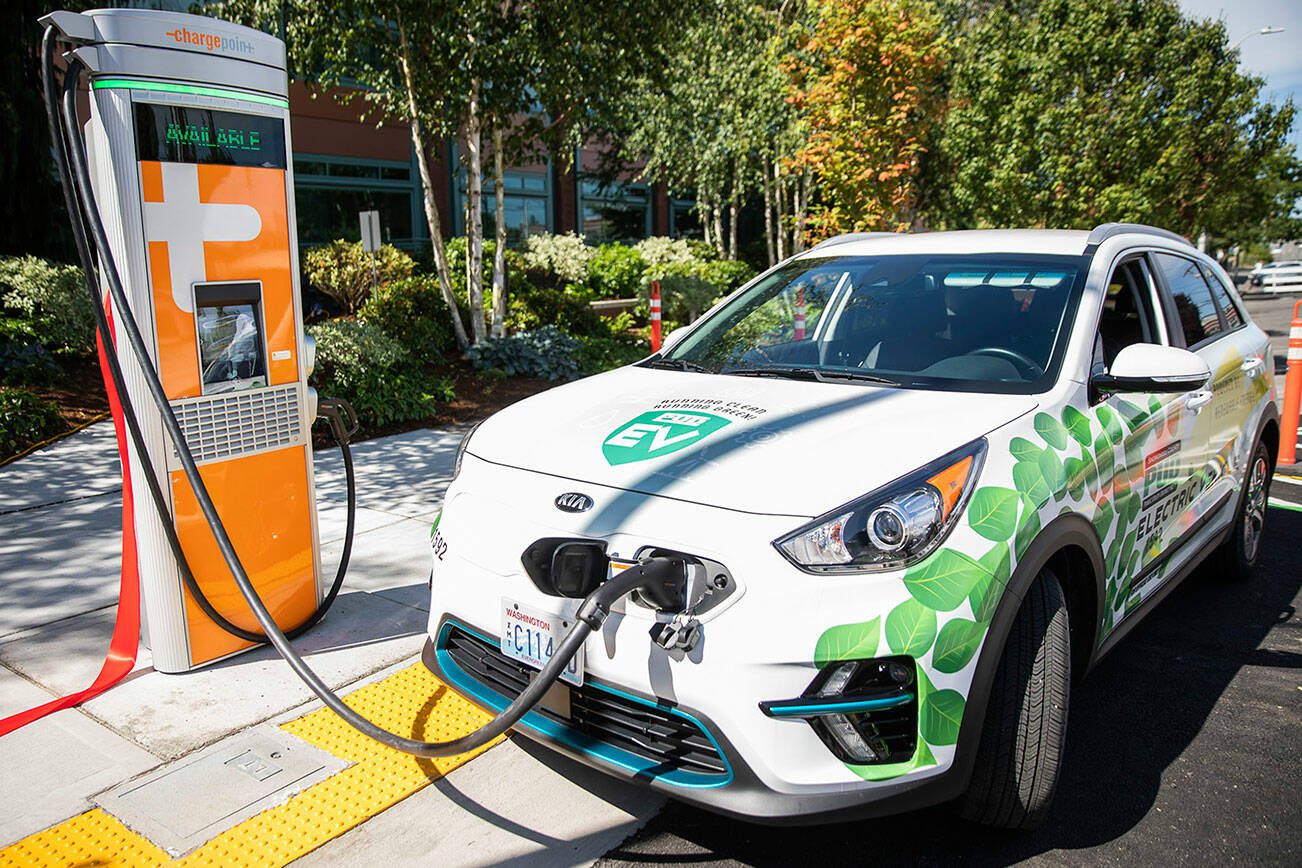 Two EV charging stations are unveiled at a ribbon cutting outside of PUD headquarters on Wednesday, July 13, 2022 in Everett, Washington. (Olivia Vanni / The Herald)
