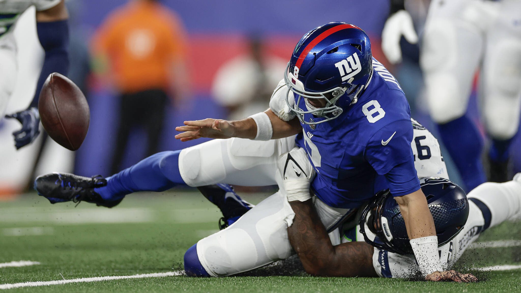 New York Giants quarterback Daniel Jones (8) fumbles the ball as he is sacked by Seattle Seahawks defensive end Mario Edwards Jr. (97) during the second quarter Monday. (AP Photo/Adam Hunger)