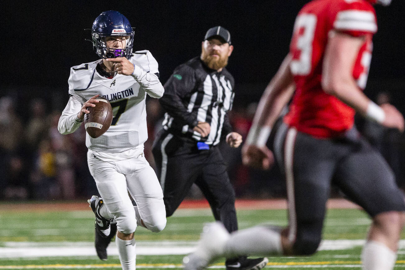 Arlington's Leyton Martin points to direct one of his teammates during the game against Stanwood on Friday, Sept. 29, 2023 in Stanwood, Washington. (Olivia Vanni / The Herald)