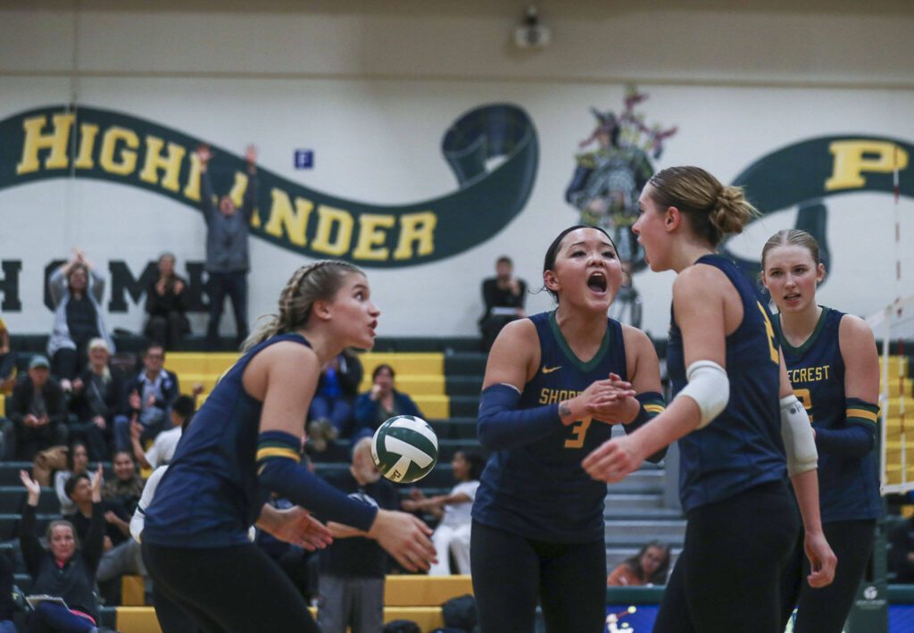 Shorecrest players celebrate during a volleyball game between Lynnwood and Shorecrest at Shorecrest High School in Shoreline, Washington on Tuesday, Oct. 3, 2023. Lynnwood took the win. (Annie Barker / The Herald)
