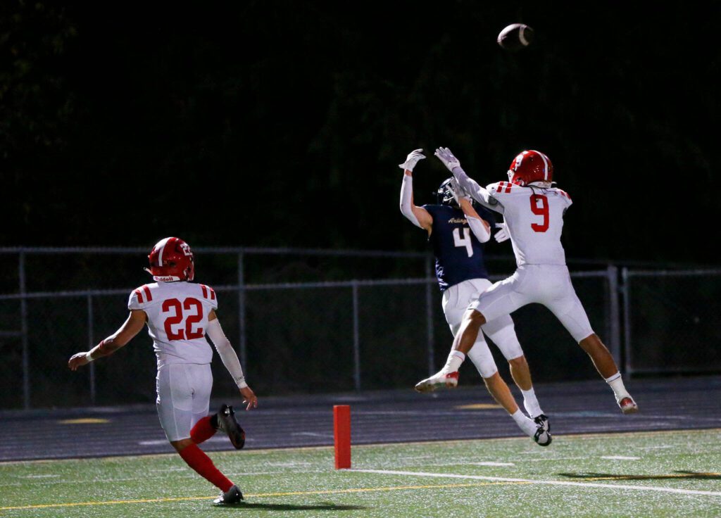 Arlington junior Jake Willis makes a juggling catch in the corner of the end zone for a first half touchdown against Marysville Pilchuck on Friday, Oct. 6, 2023, at Arlington High School in Arlington, Washington. (Ryan Berry / The Herald)
