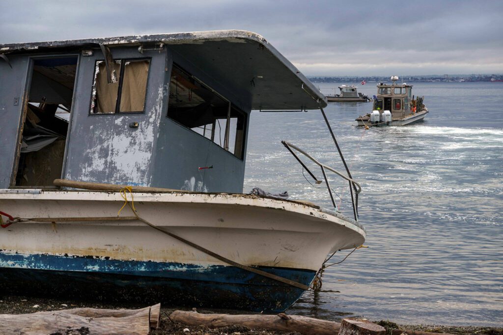 On Oct.3, 2023, an abandoned boat was towed from the Clinton shore. (Photo by David Welton)
