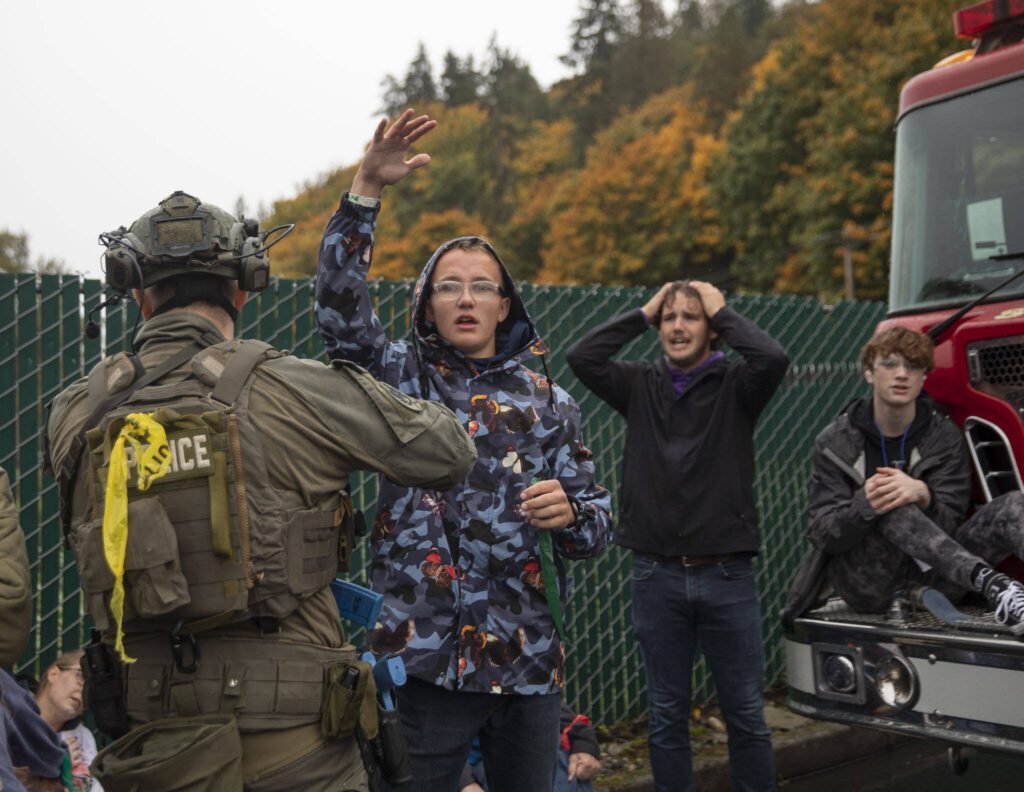 Mass casualty training volunteers act distraught and upset during the training on Wednesday, Oct. 11, 2023 in Snohomish, Washington. (Olivia Vanni / The Herald)

