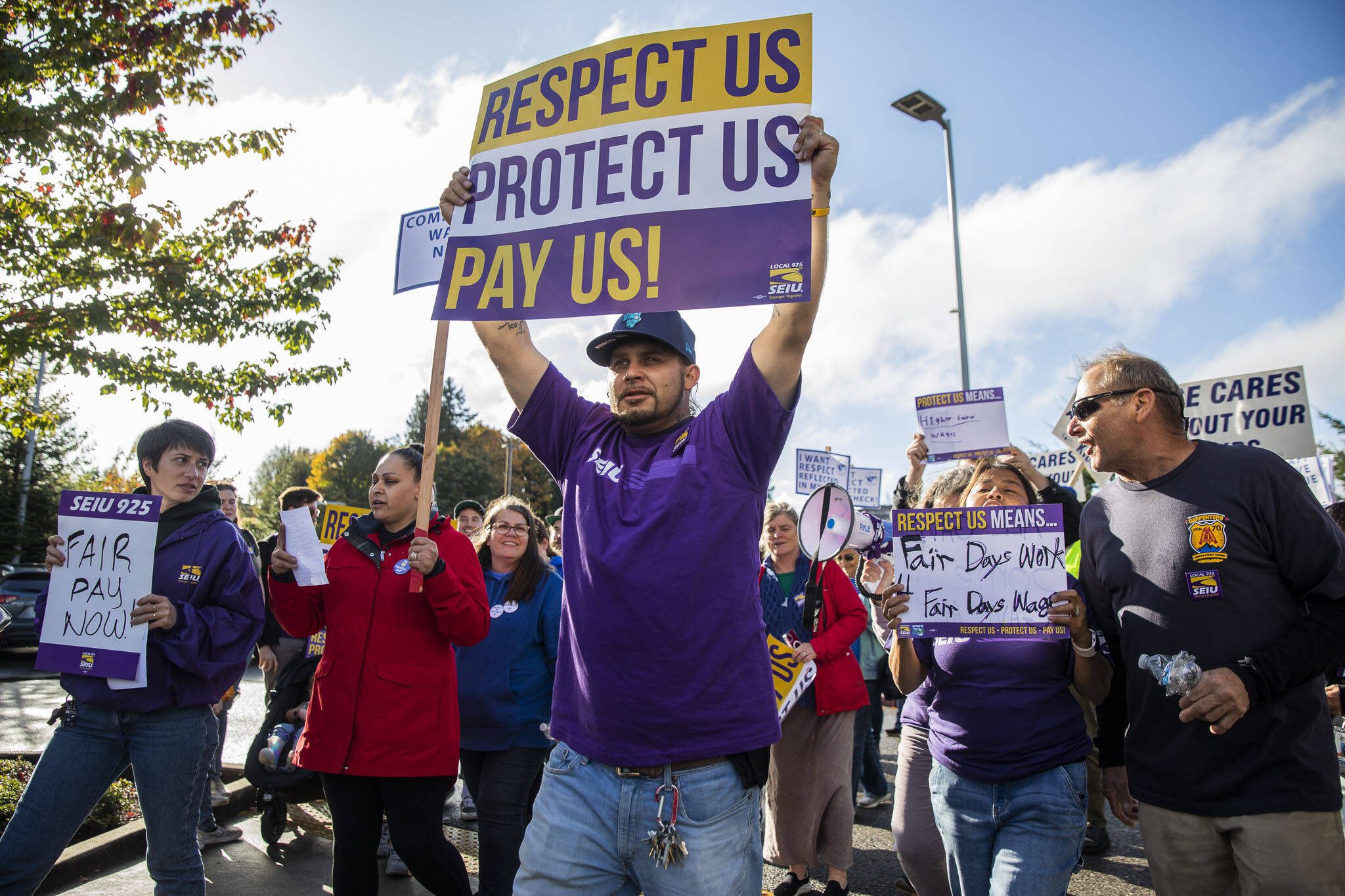 Andrew Freeman, head custodian at Everett High School, protests with other union members outside of the Everett School Board Meeting on Tuesday, Oct. 10, 2023 in Everett, Washington. (Olivia Vanni / The Herald)