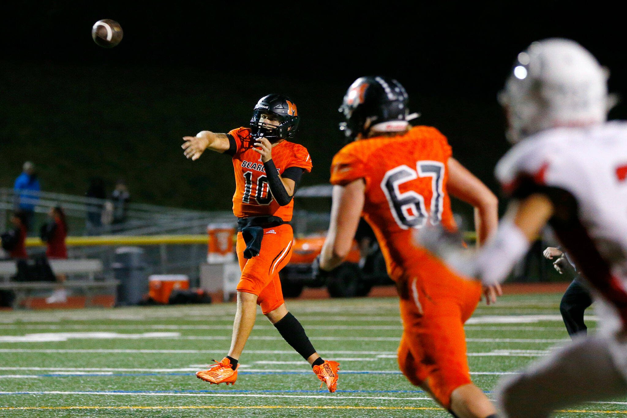 Monroe senior quarterback Blake Springer slings a first-half touchdown pass against Mountlake Terrace on Sept. 29 at Monroe High School. (Ryan Berry / The Herald)