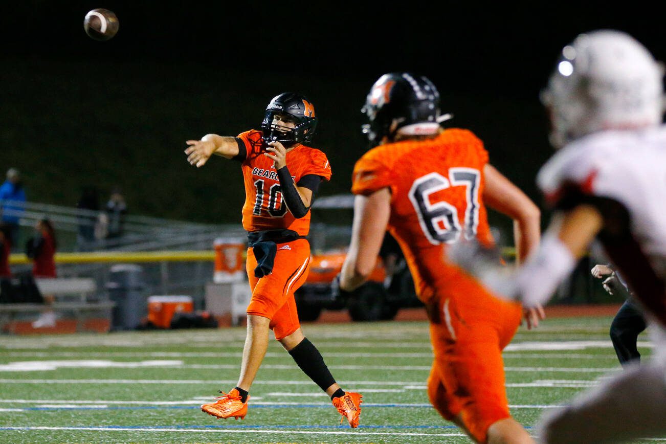 Monroe senior quarterback Blake Springer slings a first half touchdown against Mountlake Terrace on Friday, Sept. 29, 2023, at Monroe High School in Monroe, Washington. (Ryan Berry / The Herald)