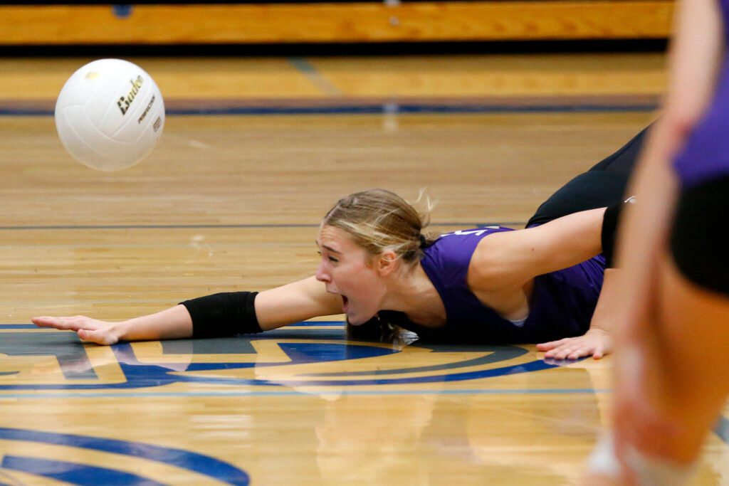 Lake Stevens’ Katelyn Eichert dives to save the ball against Glacier Peak on Tuesday, Oct. 10, 2023, at Glacier Peak High School in Snohomish, Washington. (Ryan Berry / The Herald)
