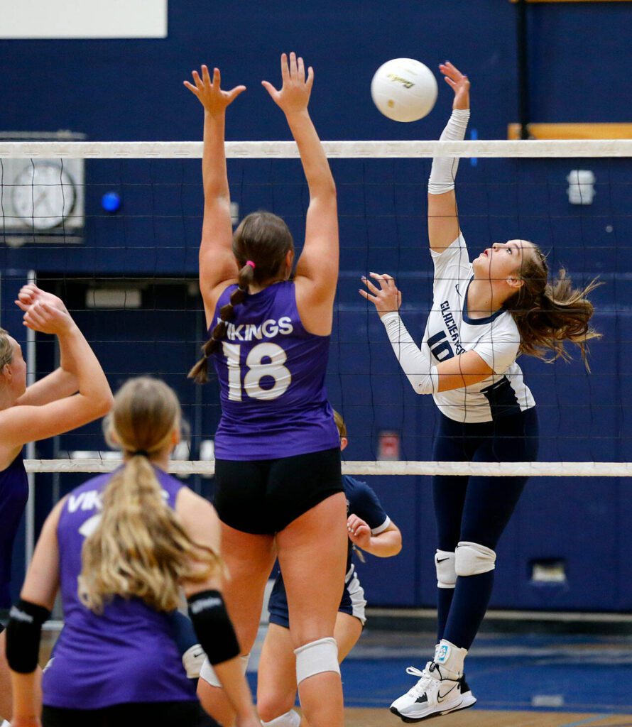 Glacier Peak’s Emma Nowak spikes the ball over the net against Lake Stevens on Tuesday, Oct. 10, 2023, at Glacier Peak High School in Snohomish, Washington. (Ryan Berry / The Herald)
