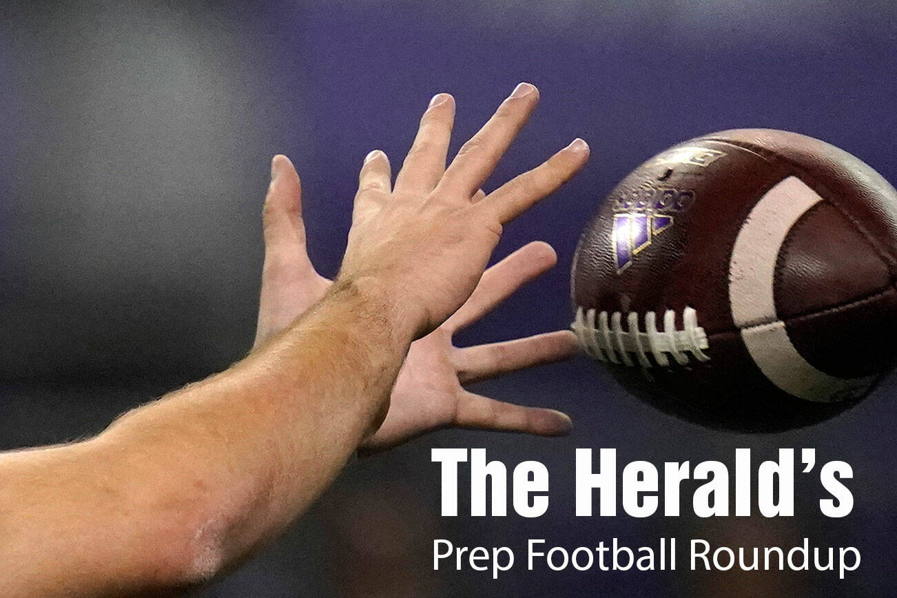 Washington quarterback Dylan Morris reaches for the ball against Arizona during the first half of an NCAA college football game Saturday, Nov. 21, 2020, in Seattle. (AP Photo/Elaine Thompson)