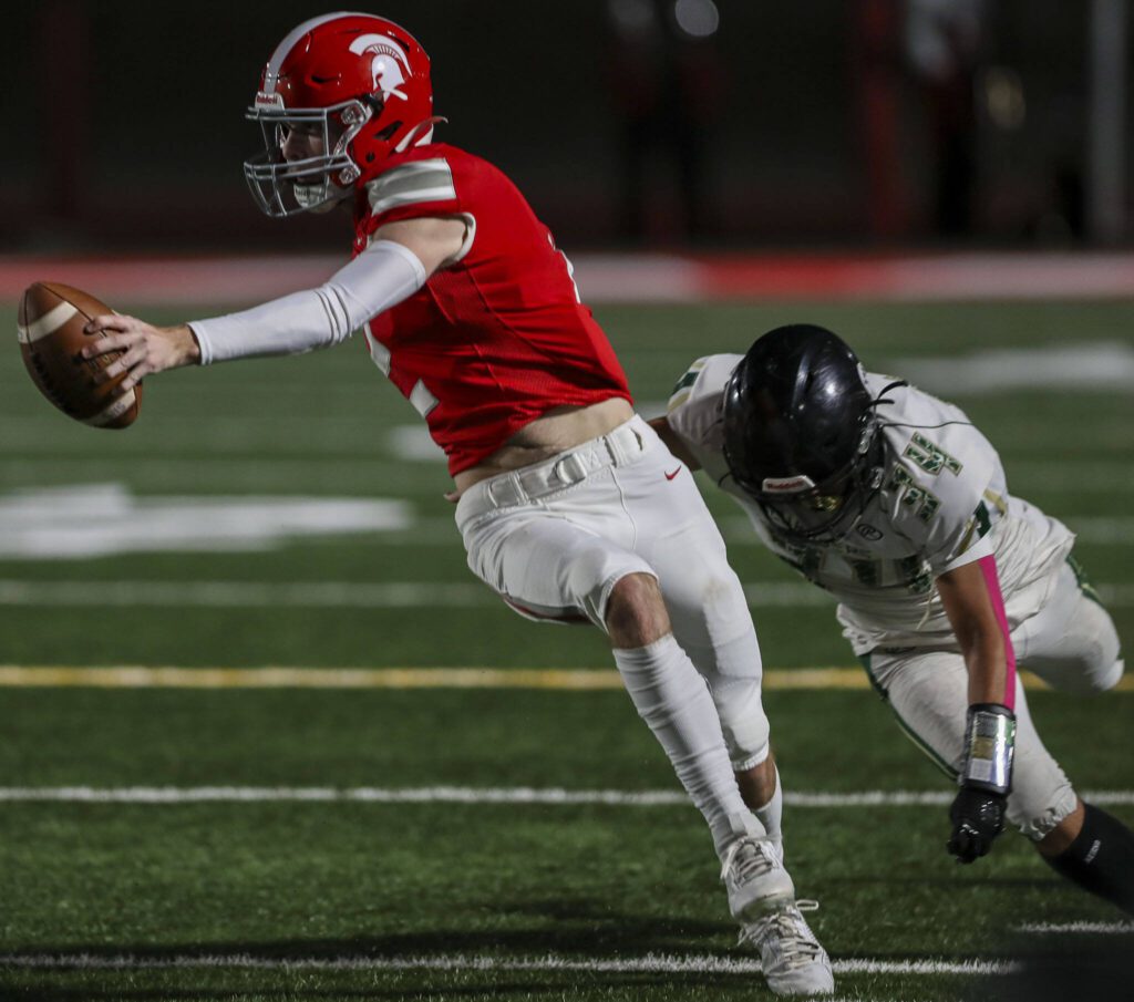 Stanwood’s Luke Brennan (2) runs with the ball during a game between Marysville-Getchell and Stanwood at Stanwood High School in Stanwood, Washington on Friday, Oct. 13, 2023. Marysville-Getchell won, 21-20. (Annie Barker / The Herald)
