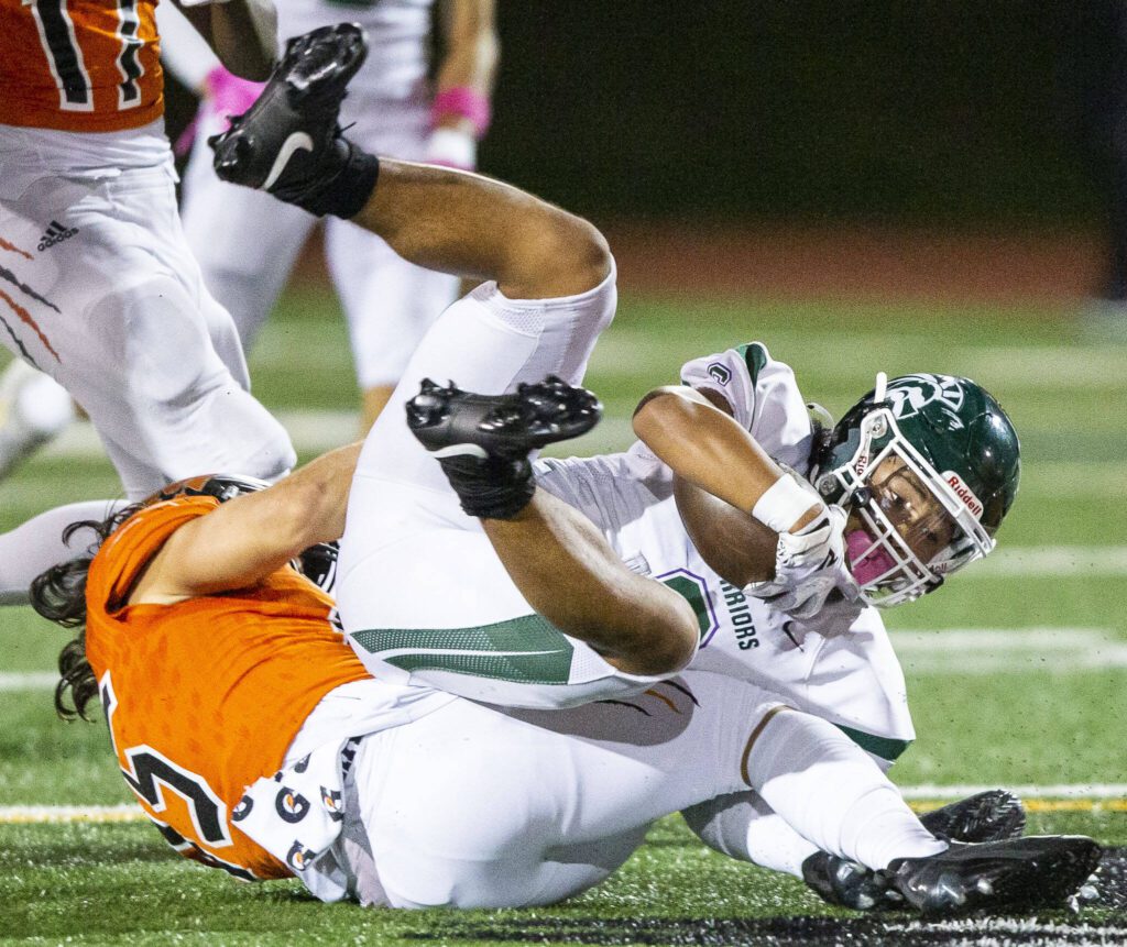 Edmonds-Woodway’s Jesse Hart is tackled during the game against Monroe on Friday, Oct. 13, 2023 in Monroe, Washington. (Olivia Vanni / The Herald)
